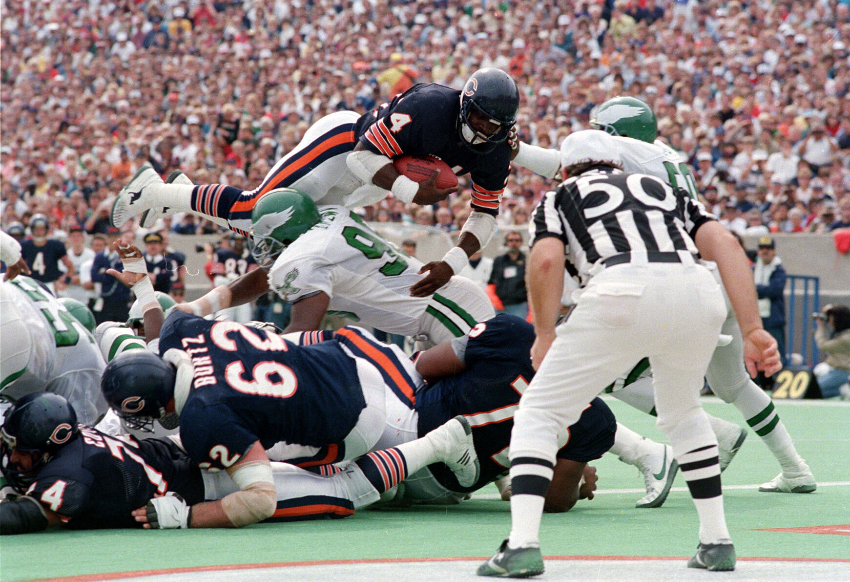 1986: Chicago's Walter Payton reaches 15,000-yard plateau, scores 100th rushing TD